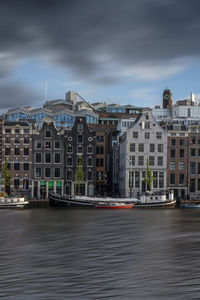 Long exposure shot of amsterdam canal at sunset