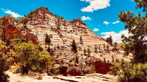 Rock formations on mountain against sky