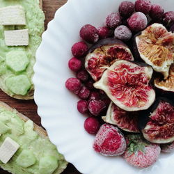 High angle view of strawberries in plate on table