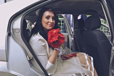 Portrait of women sitting in car