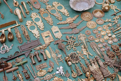 High angle view of various antique objects for sale