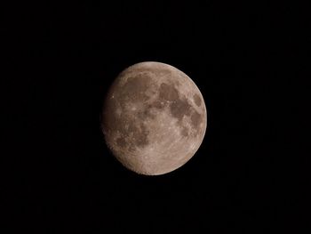 Low angle view of moon against clear sky at night