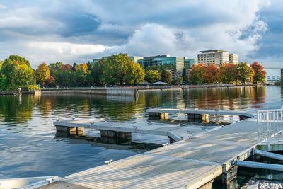 A view of the docks and shoreline with autumn trees at gene coulon park in renton, washington.