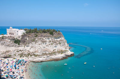 High angle view of sea against blue sky