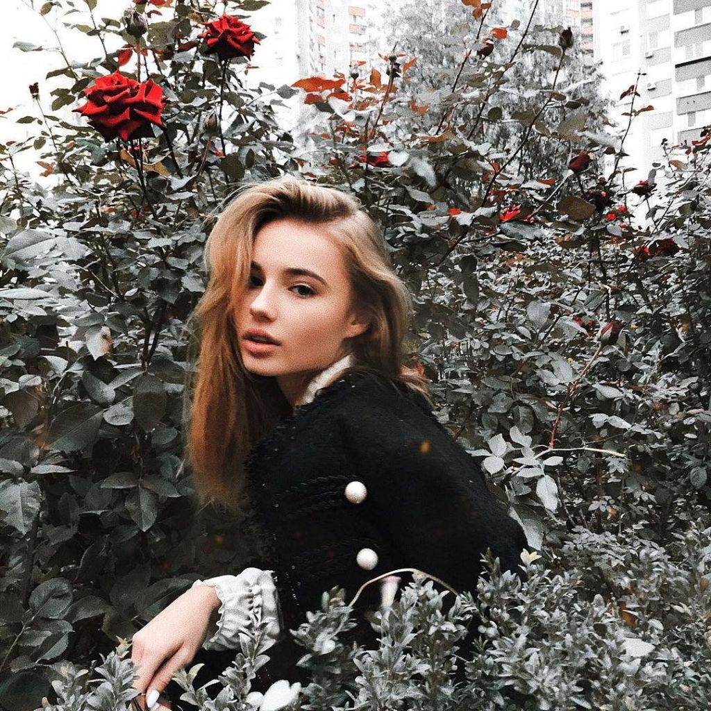 one person, plant, hair, portrait, winter, young adult, real people, young women, lifestyles, cold temperature, hairstyle, nature, women, blond hair, flowering plant, flower, tree, leisure activity, long hair, beautiful woman, warm clothing, outdoors, extreme weather
