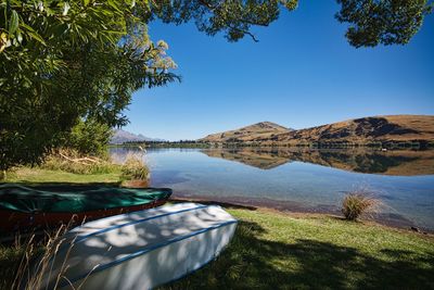 Scenic view of lake against blue sky