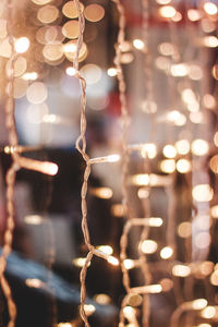 Close-up of illuminated christmas lights at night