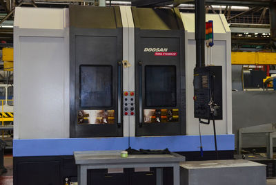 Low angle view of telephone booth in city at night
