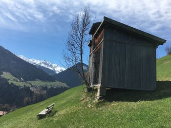 House on field against sky