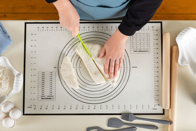 Midsection of man working on table