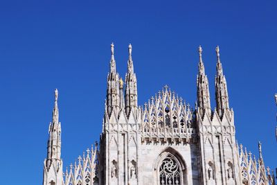 Low angle view of building against blue sky