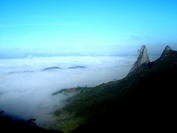 Scenic view of mountains against clear blue sky