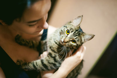 Close-up of woman holding cat