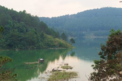 Scenic view of lake with mountains in background