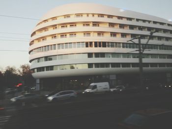 Vehicles on road along buildings