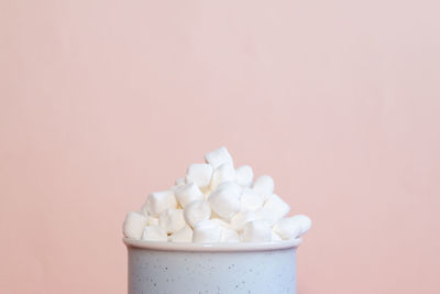 Close-up of cake against white background