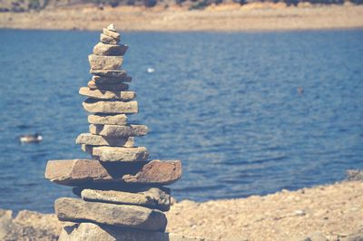 Stack on rocks against sea