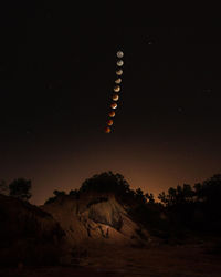 Low angle view of moon against sky at night