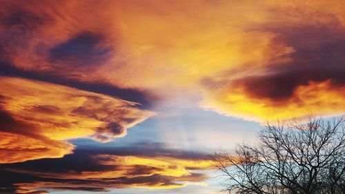 Low angle view of dramatic sky during sunset