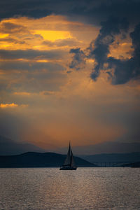 Sailing yacht in the sunset off the croatian coast in summer.