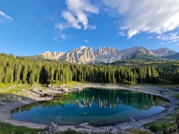 Scenic view of lake and mountains against sky