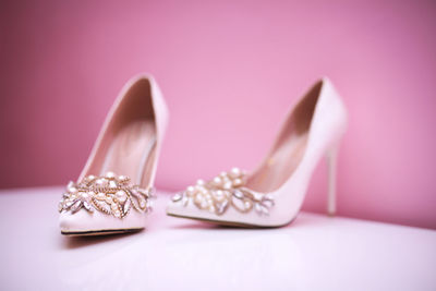 Close-up of wedding rings on table