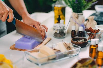 Midsection of person preparing food on table