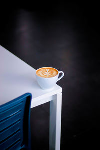 Close-up of coffee cup on table