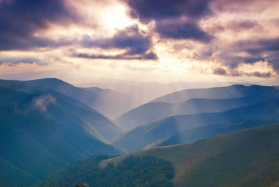 Scenic view of mountains against sky during sunset