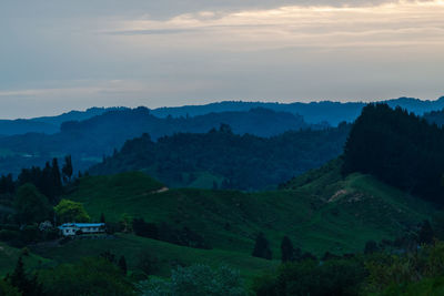 Scenic view of landscape and mountains against sky