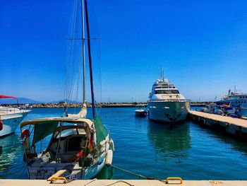 Boats moored at harbor