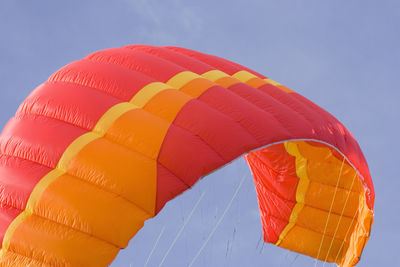 Low angle view of parachute against sky