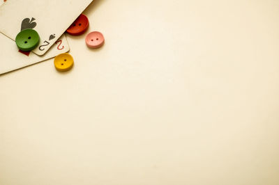 Close-up of buttons and cards on table