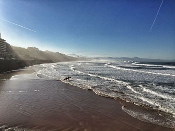 Scenic view of sea against blue sky