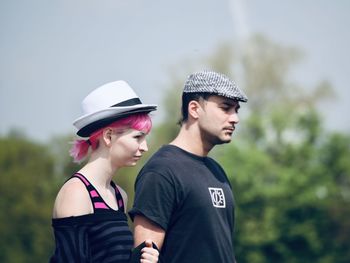 Young couple looking away