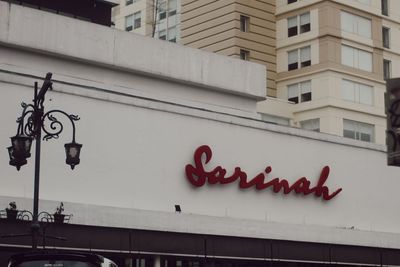 Low angle view of text on building