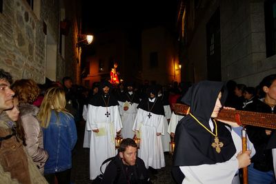 Group of people in front of building at night