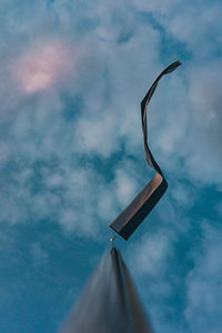 Low angle view of a flag against sky