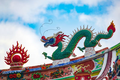 Low angle view of statue against sky