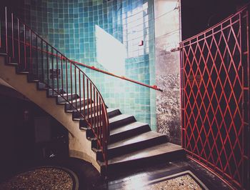 Staircase against tiled wall in old house