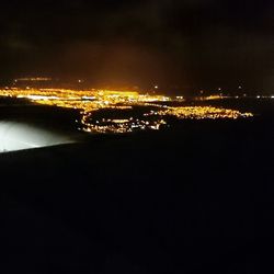 Aerial view of illuminated cityscape at night