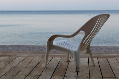 Empty chairs on beach