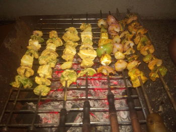 High angle view of meat on barbecue grill