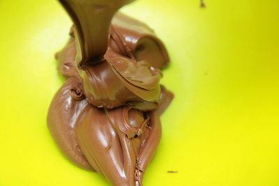 Close-up of chocolate over white background