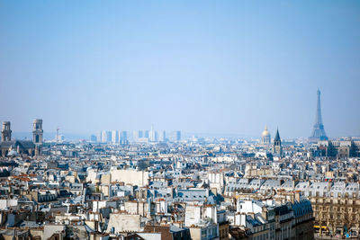 View of cityscape against blue sky