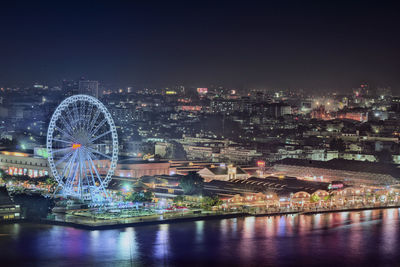 Illuminated buildings in city at night