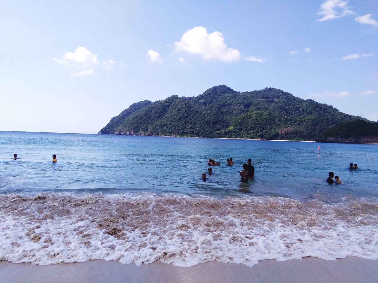 PEOPLE ENJOYING AT BEACH