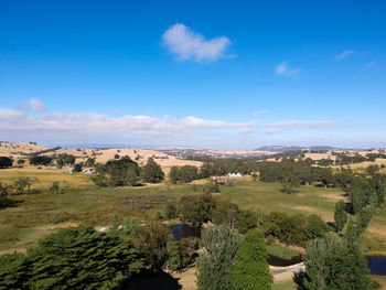 Scenic view of landscape against blue sky