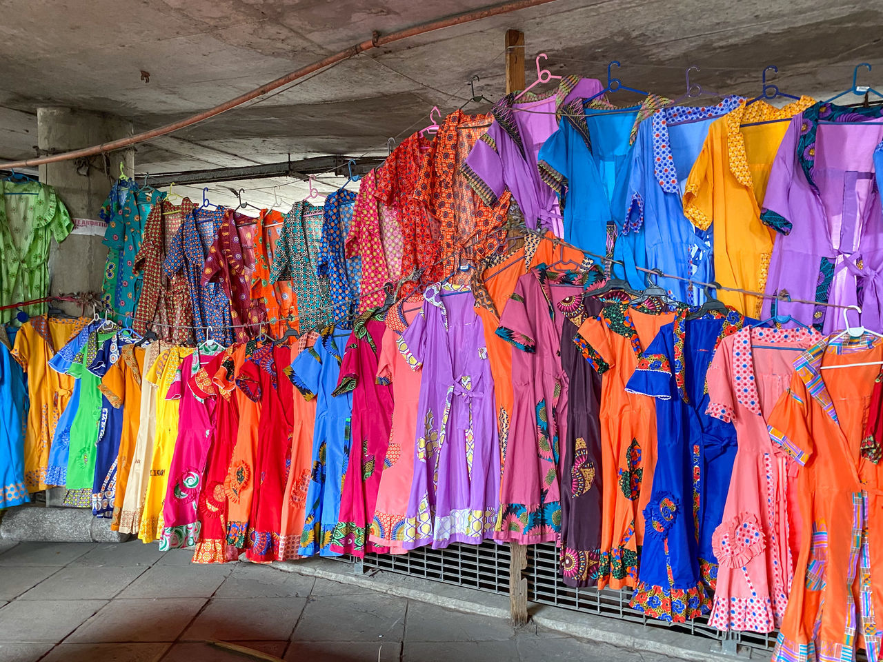 MULTI COLORED UMBRELLAS HANGING AT MARKET