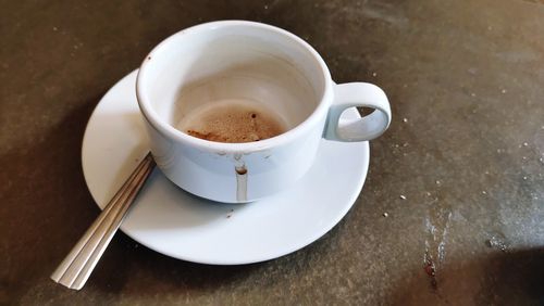 High angle view of coffee cup on table